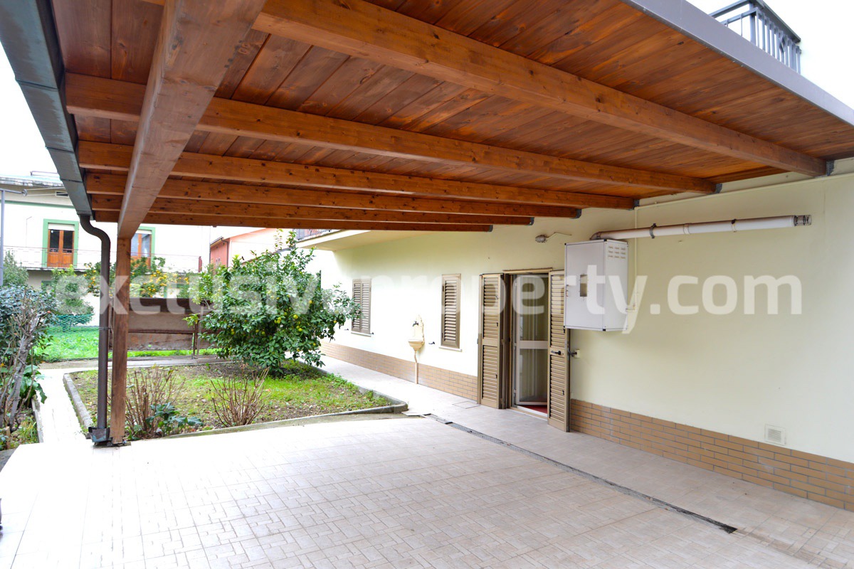 Spacious property with wooden veranda and garden divided two apartments