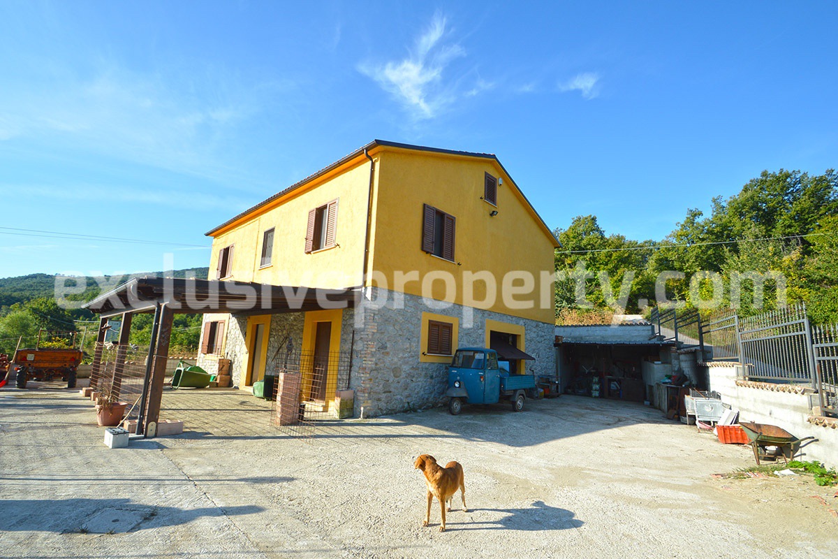 Detached country house with land and wooden veranda for sale in Italy 2