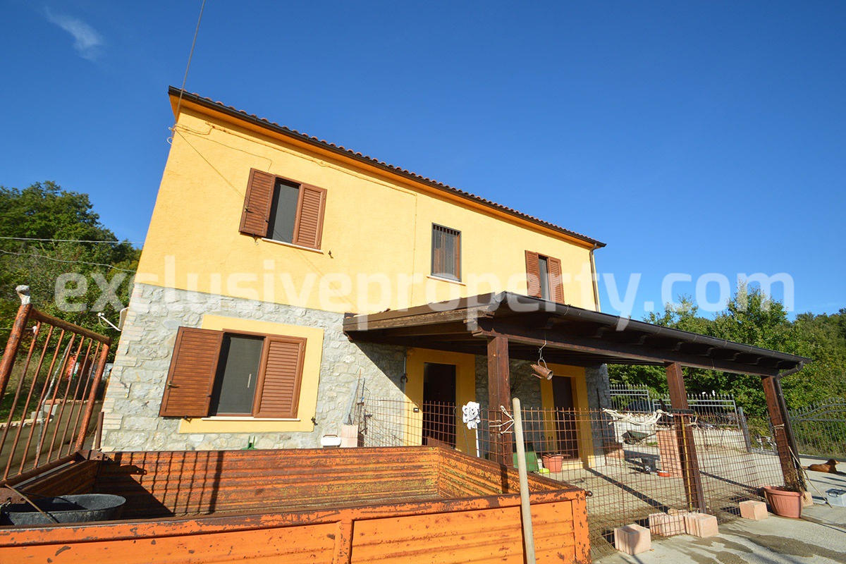 Detached country house with land and wooden veranda for sale in Italy 3