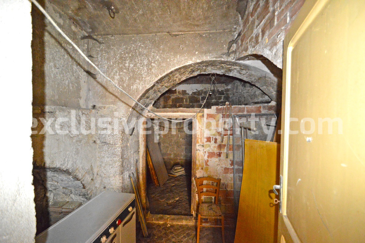 Ancient stone house with a hilly view for sale in Italy