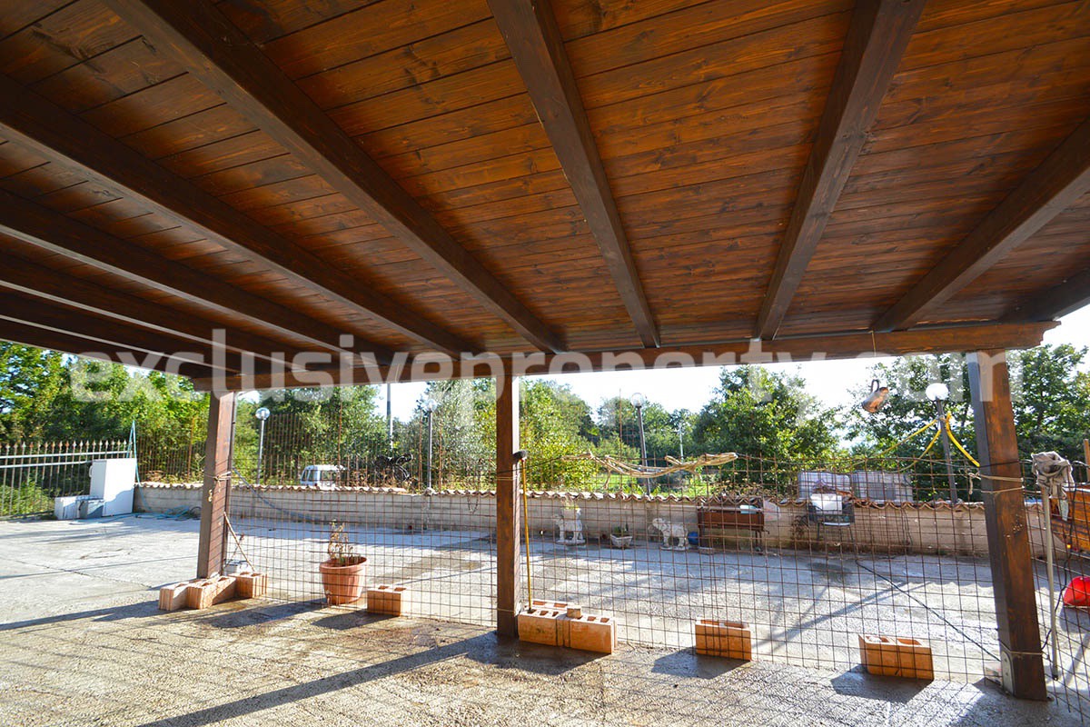 Detached country house with land and wooden veranda for sale in Italy 6