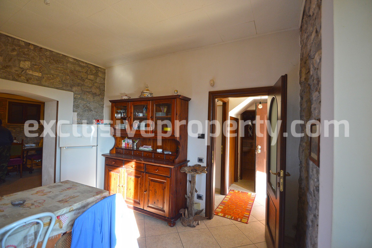 Detached country house with land and wooden veranda for sale in Italy 8