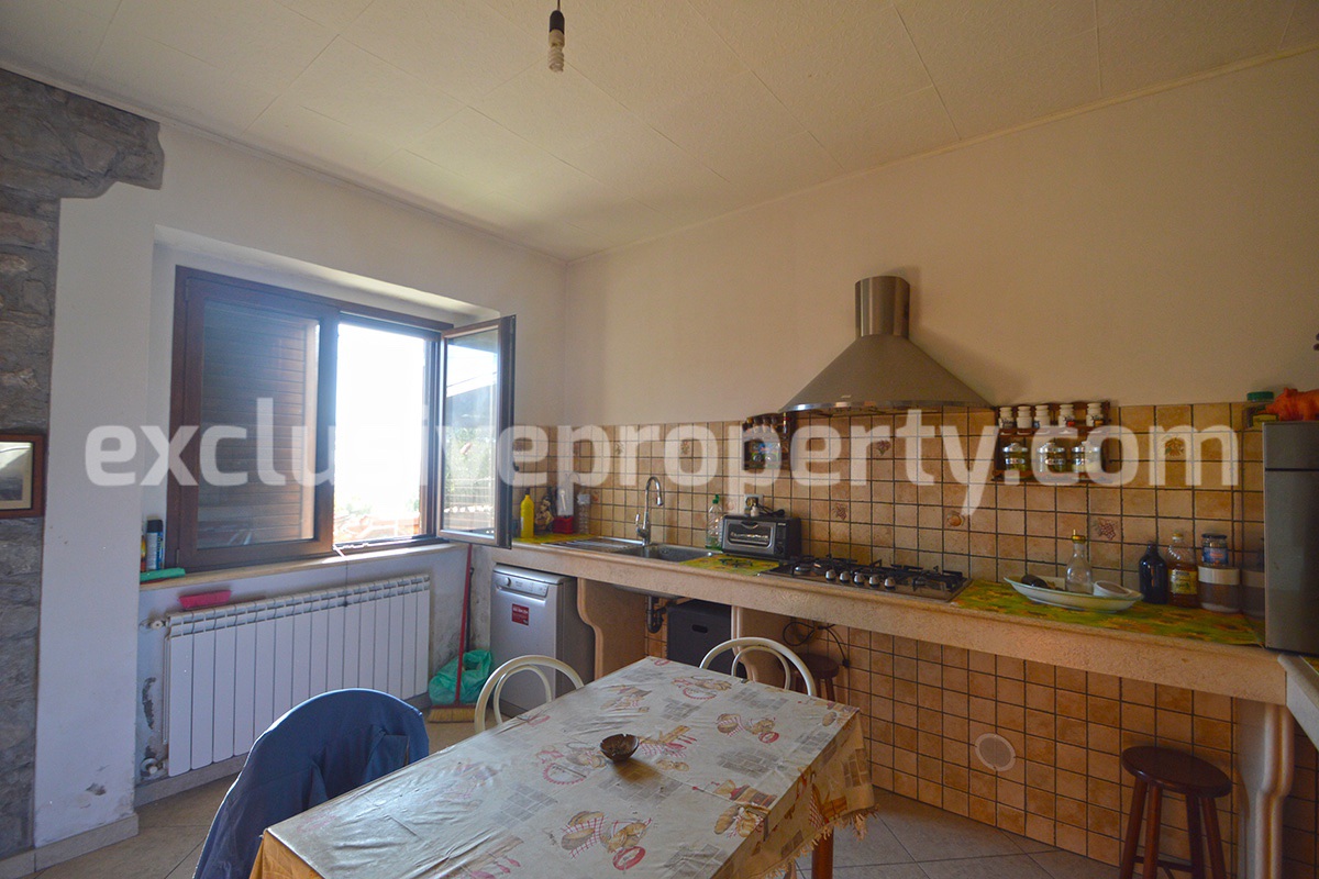 Detached country house with land and wooden veranda for sale in Italy 10