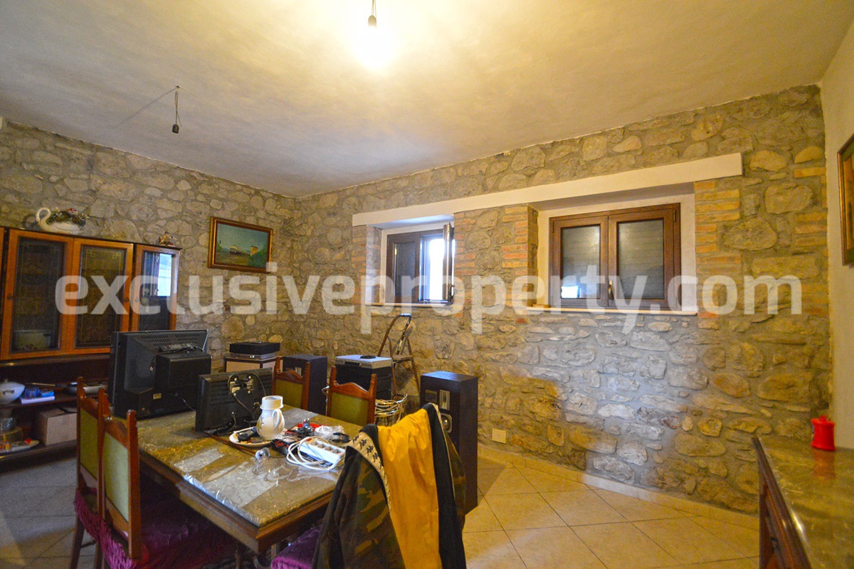 Detached country house with land and wooden veranda for sale in Italy 11