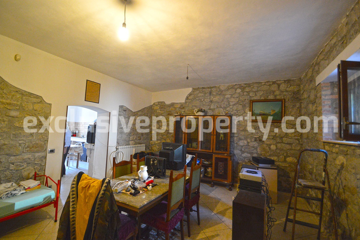 Detached country house with land and wooden veranda for sale in Italy 12