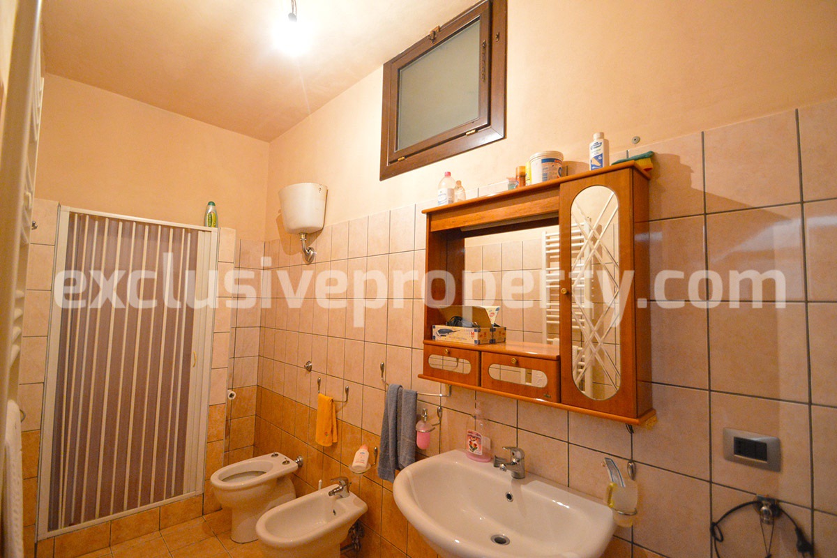 Detached country house with land and wooden veranda for sale in Italy 13
