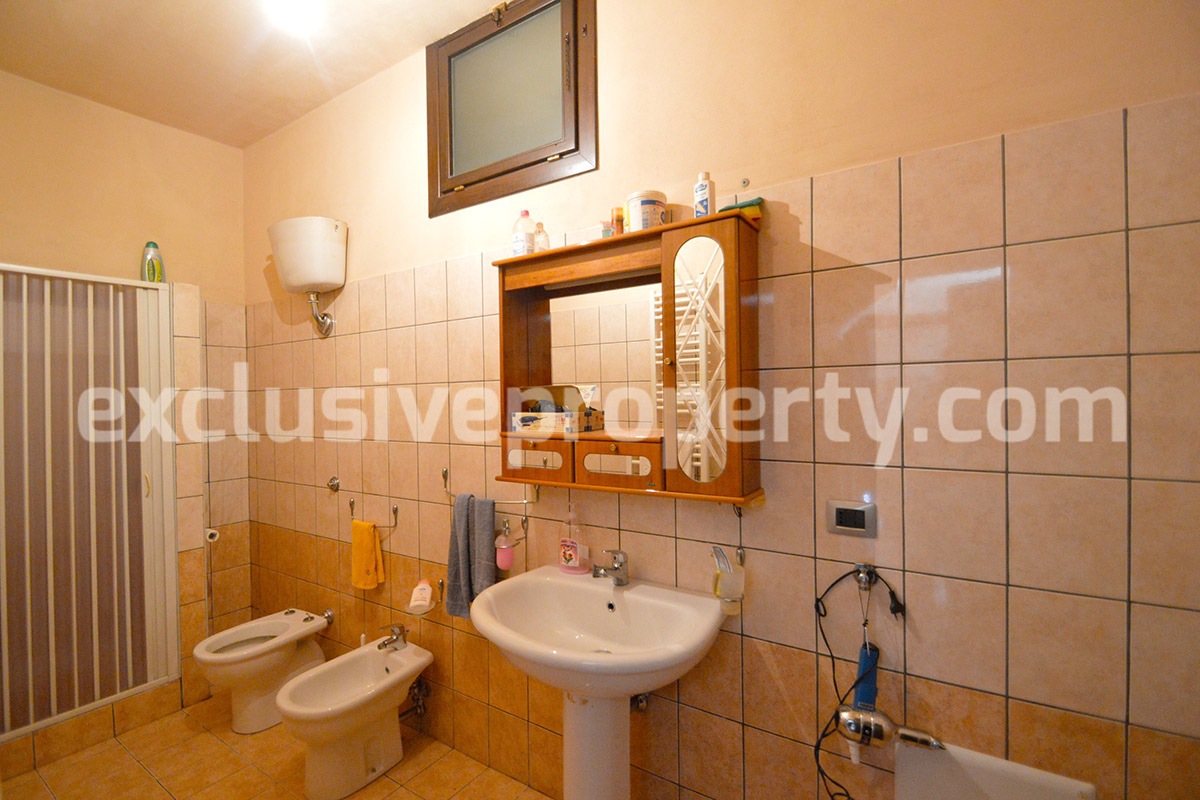 Detached country house with land and wooden veranda for sale in Italy 14