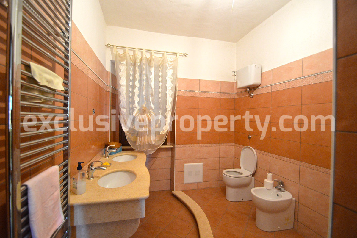 Detached country house with land and wooden veranda for sale in Italy 18