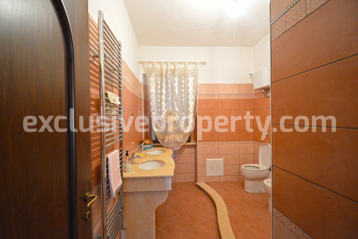 Detached country house with land and wooden veranda for sale in Italy 19