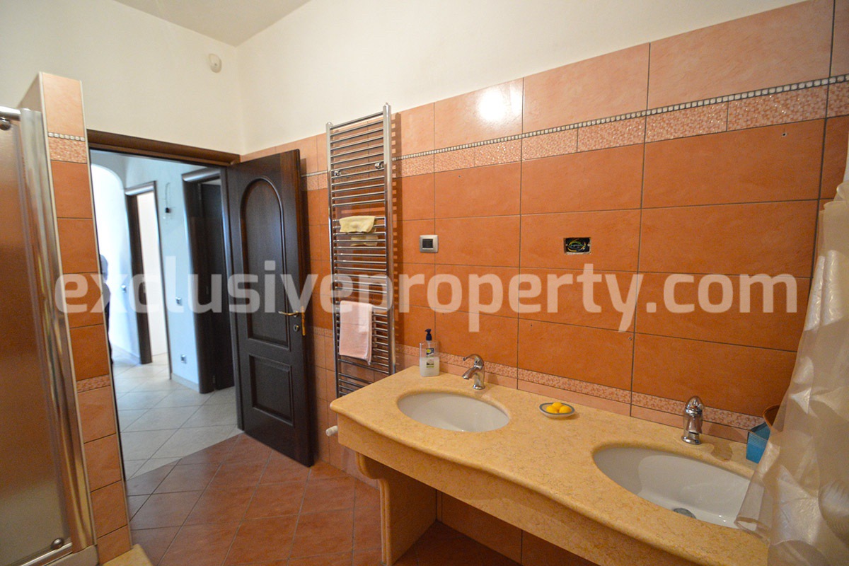 Detached country house with land and wooden veranda for sale in Italy 21