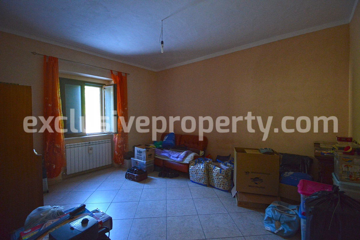 Detached country house with land and wooden veranda for sale in Italy 24