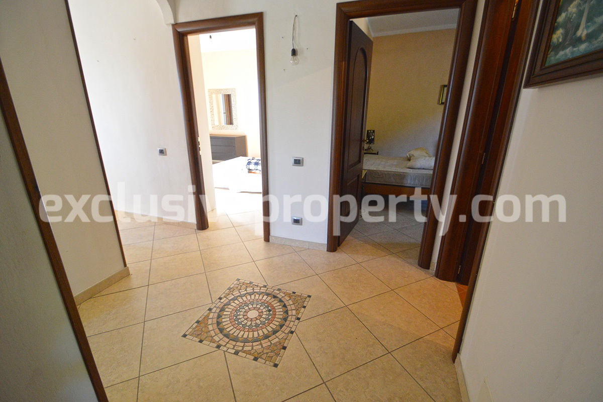 Detached country house with land and wooden veranda for sale in Italy 25
