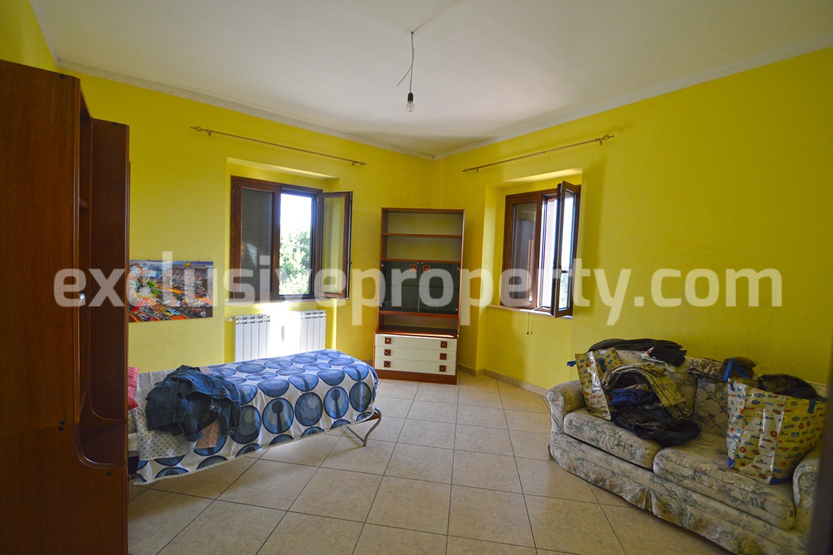 Detached country house with land and wooden veranda for sale in Italy 26