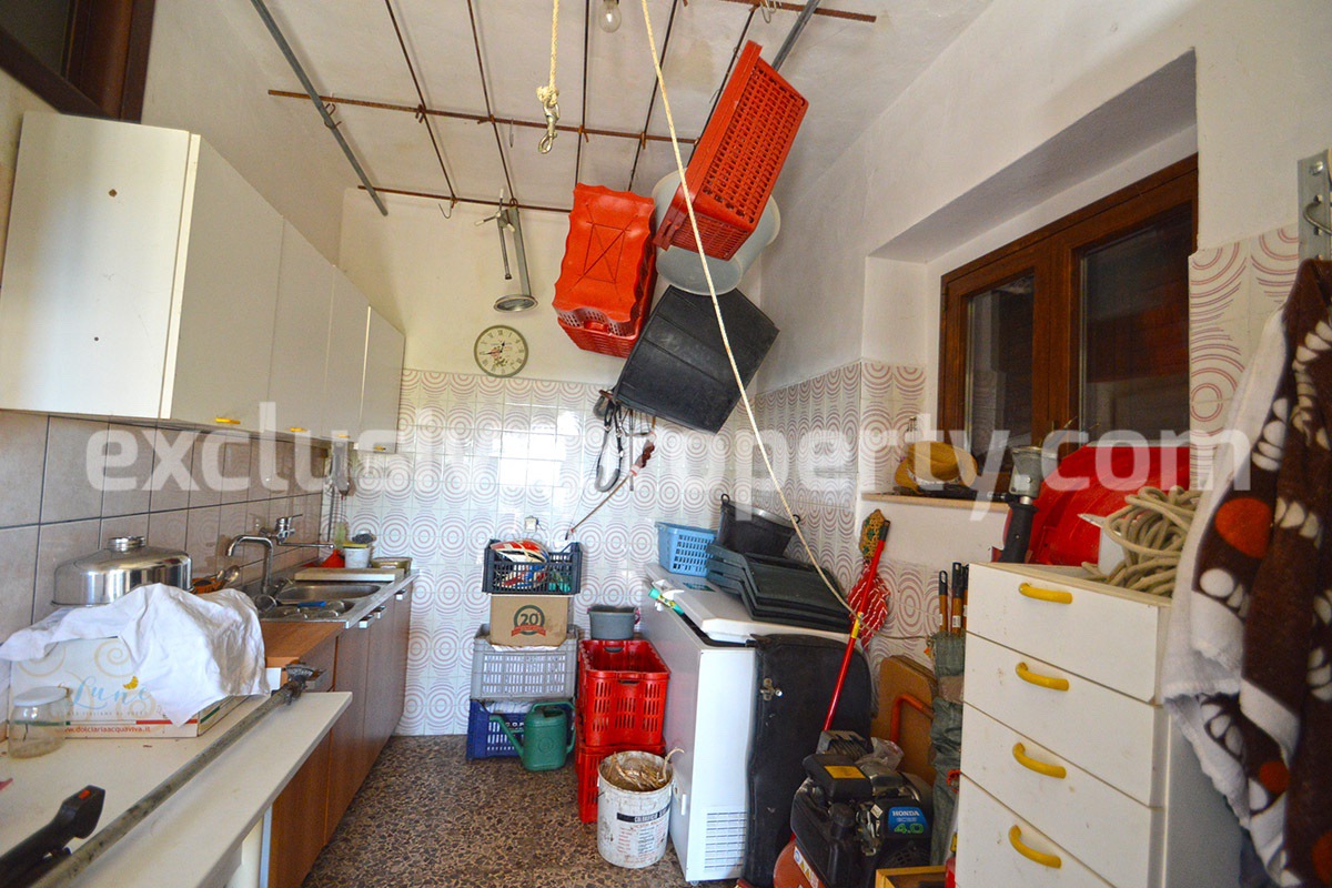 Detached country house with land and wooden veranda for sale in Italy 29