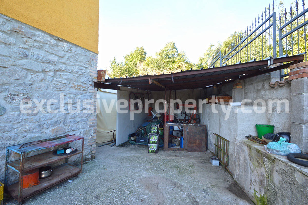 Detached country house with land and wooden veranda for sale in Italy 31