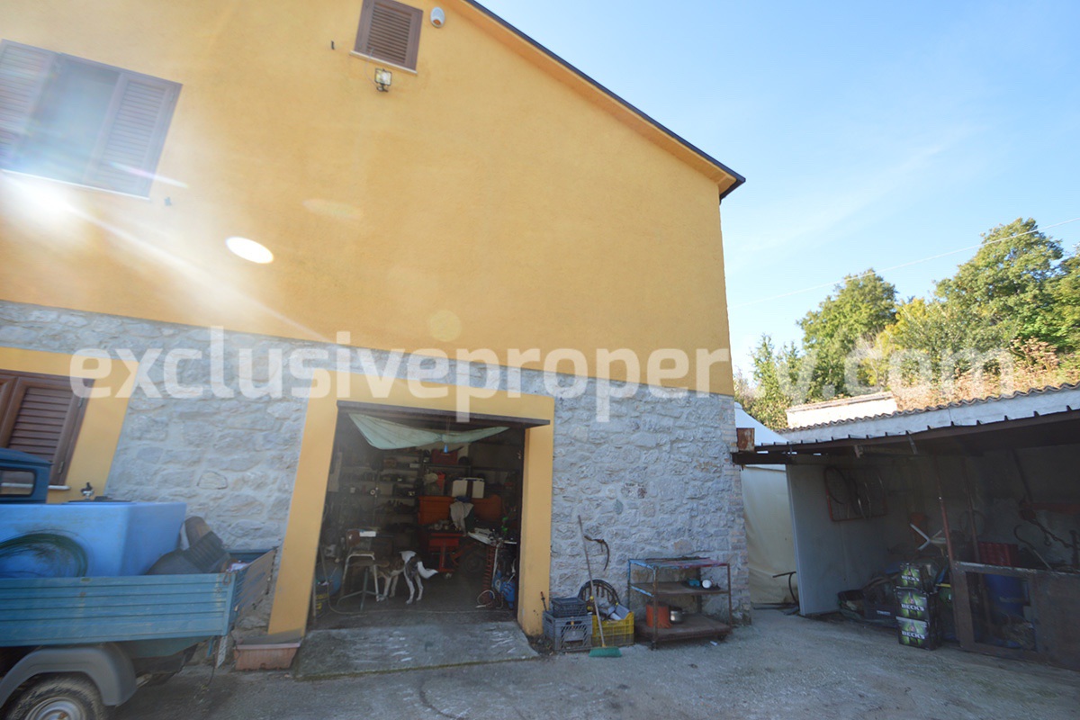 Detached country house with land and wooden veranda for sale in Italy 32