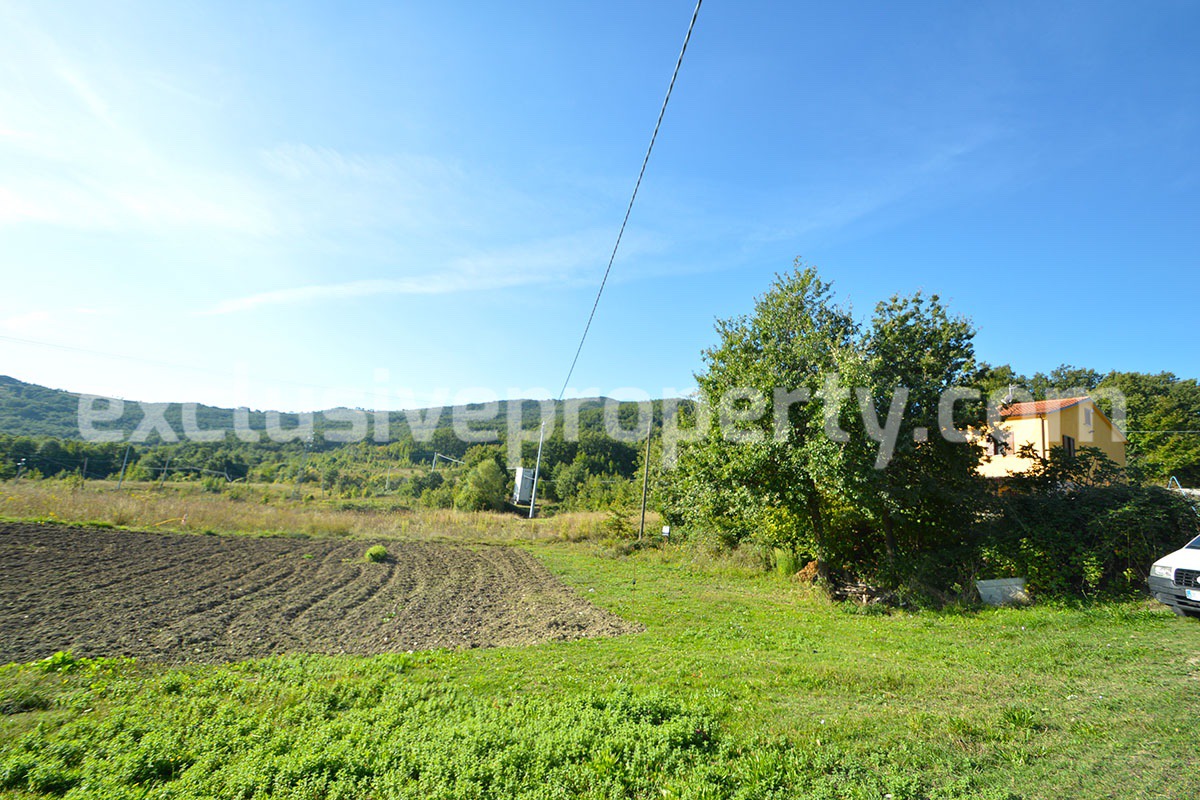 Detached country house with land and wooden veranda for sale in Italy 35