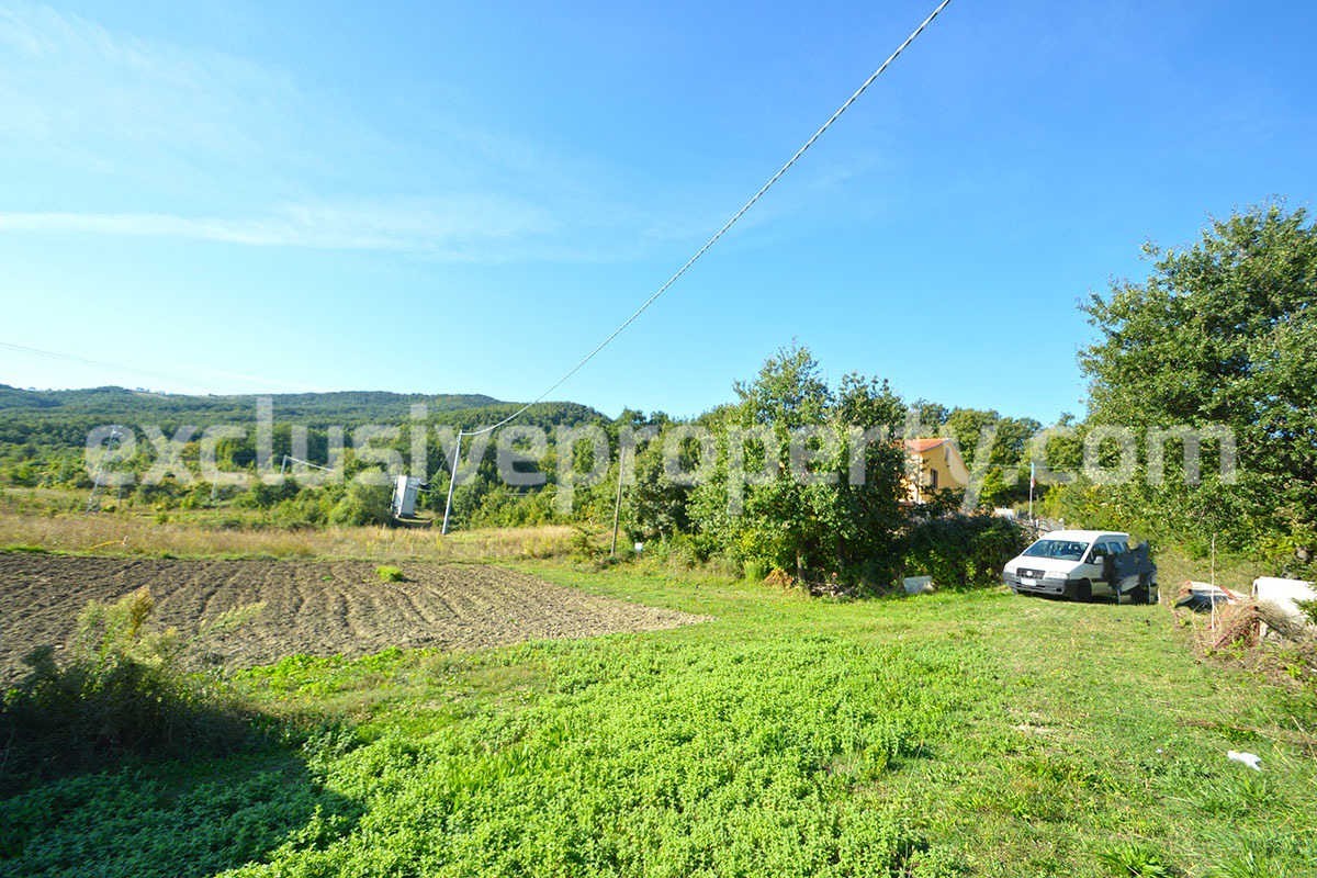 Detached country house with land and wooden veranda for sale in Italy 36