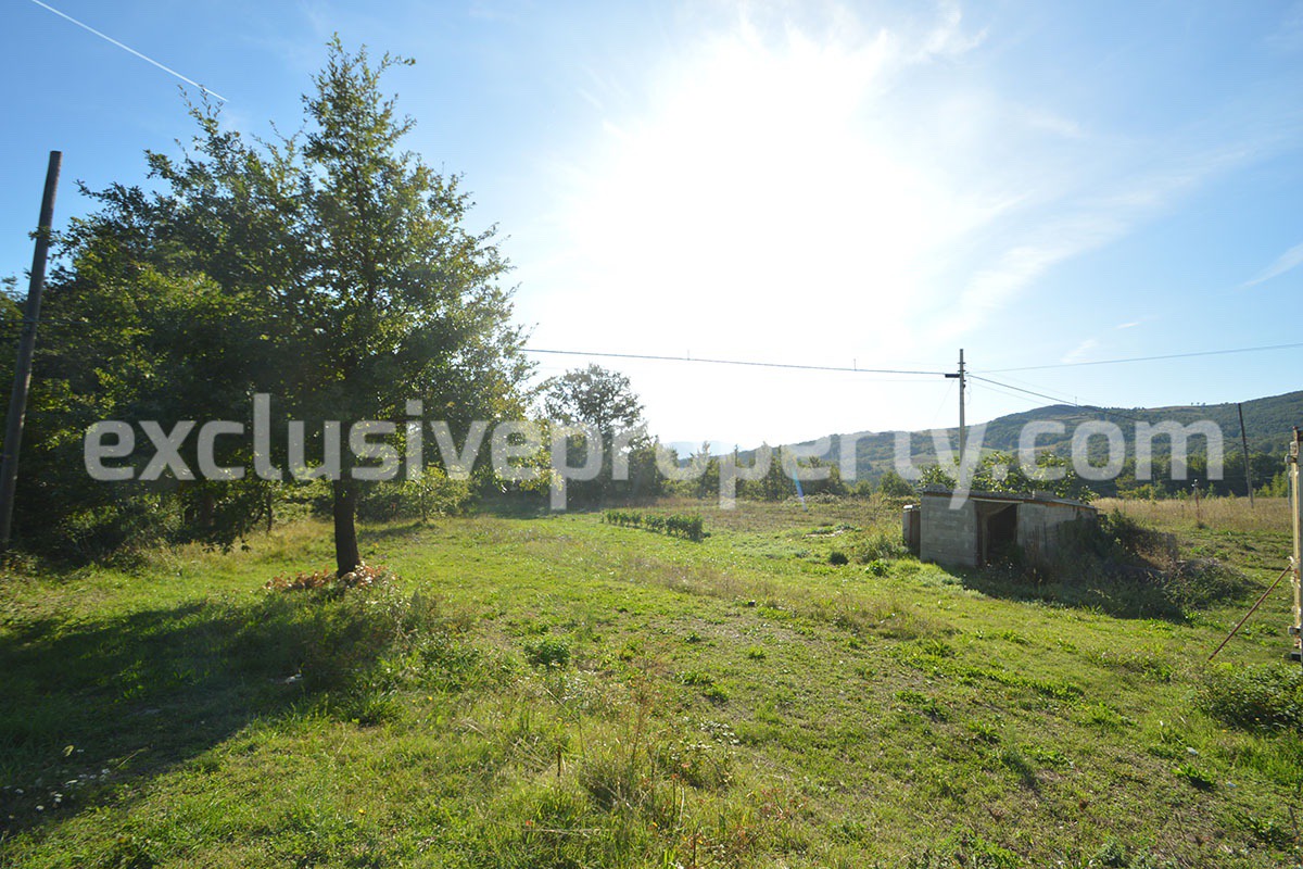 Detached country house with land and wooden veranda for sale in Italy 38