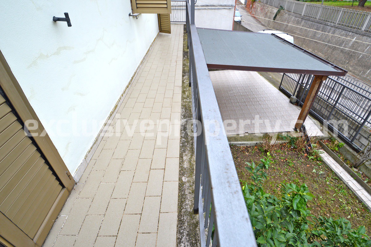 Spacious property with wooden veranda and garden divided two apartments