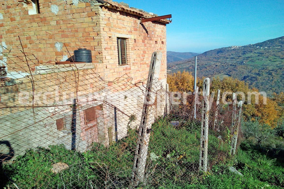 Brick farmhouse surrounded by nature with well for sale in Italy 2