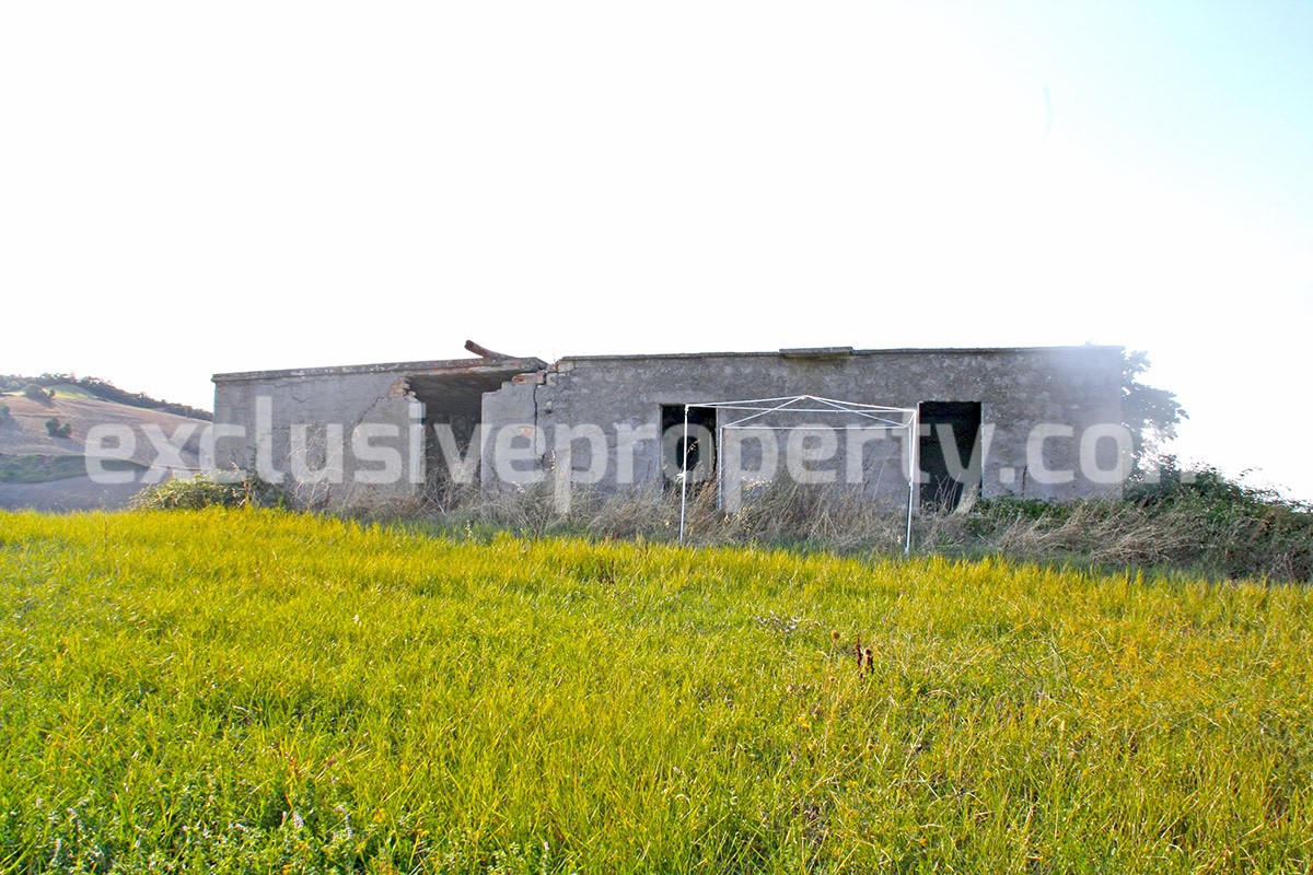 Ruin with two hectares of land with mountain and sea view for sale in Italy