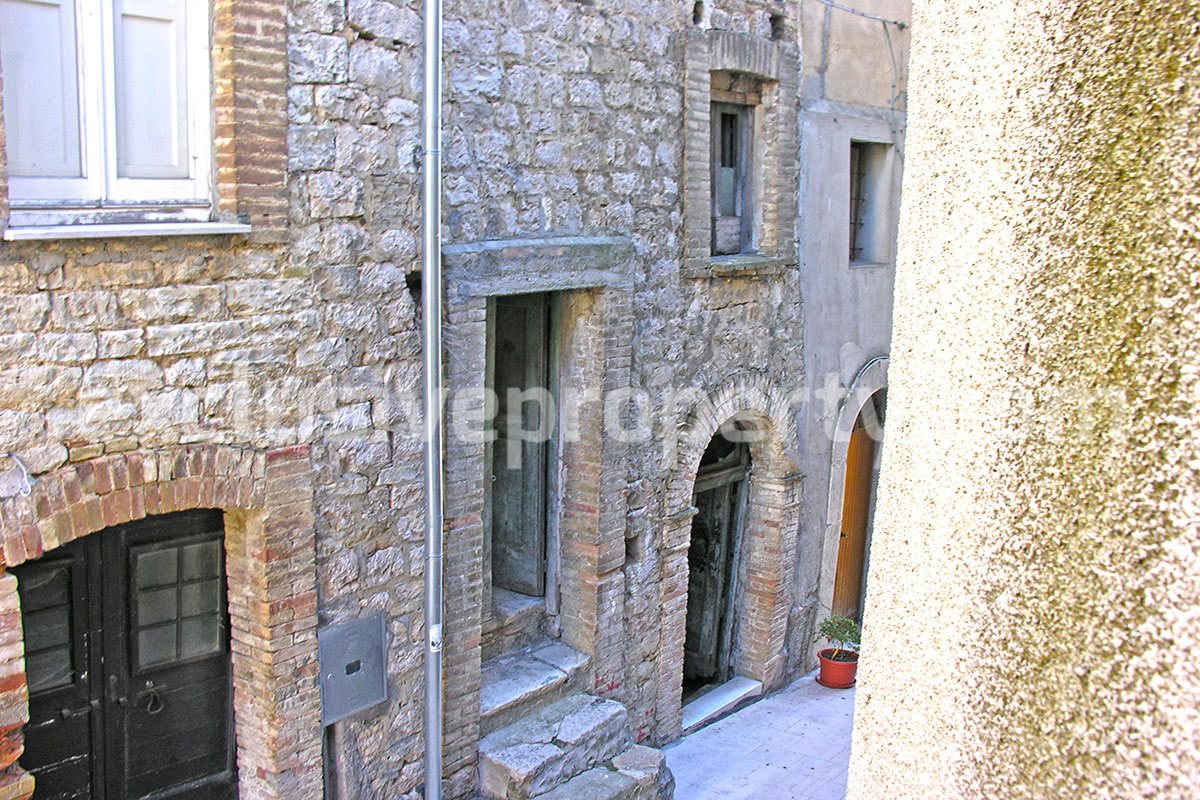 Stone town house with two terraces view sea and mountains for sale in Italy