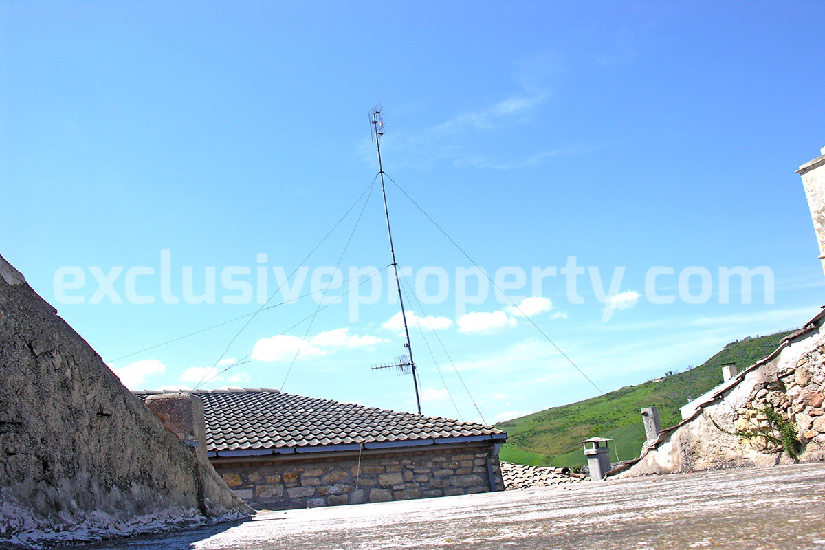 Stone town house with two terraces view sea and mountains for sale in Italy
