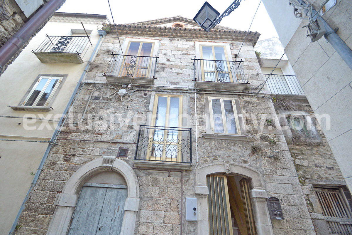 Ancient stone house with antique marble doors for sale near the castle Italy