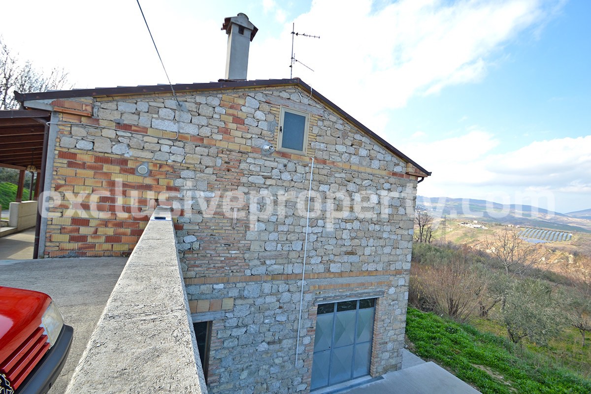 House with a wooden veranda and garage for sale in Abuzzo 2
