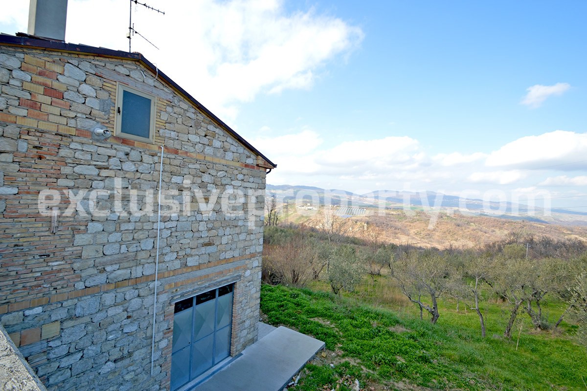House with a wooden veranda and garage for sale in Abuzzo 1