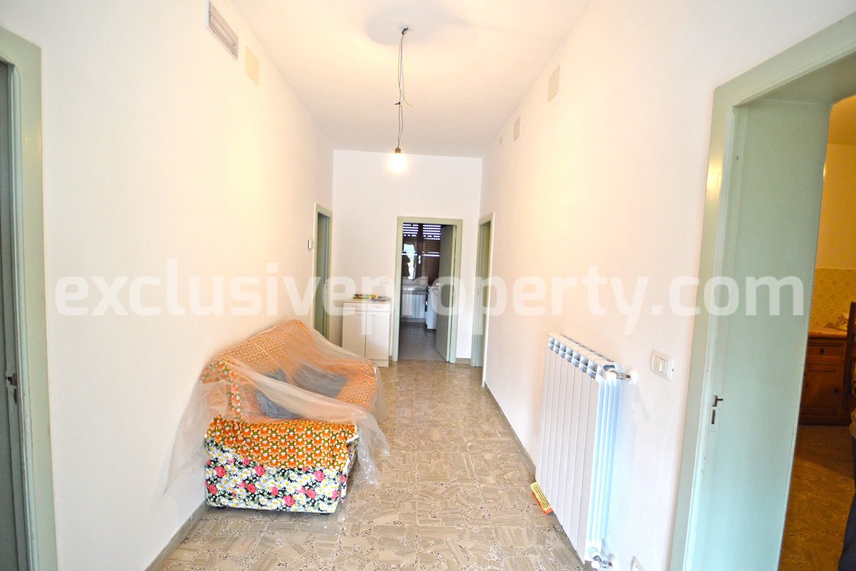 House with a wooden veranda and garage for sale in Abuzzo