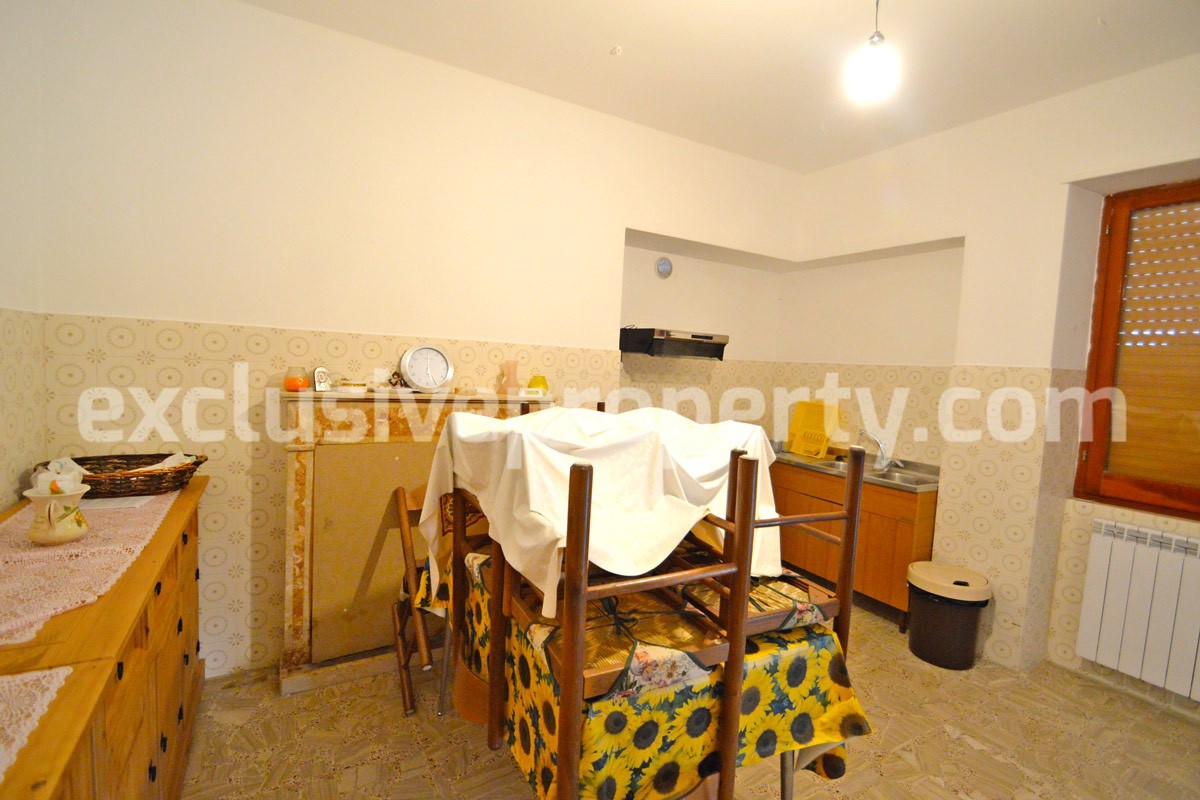 House with a wooden veranda and garage for sale in Abuzzo