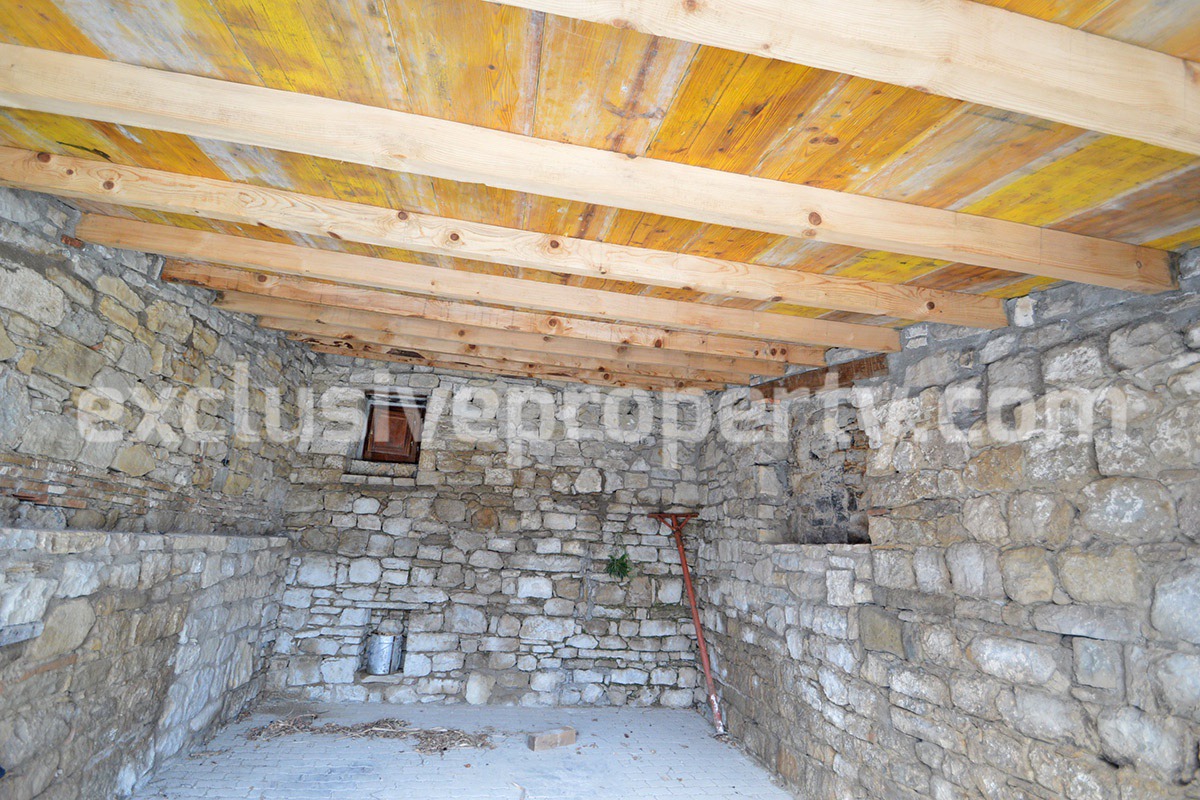 Renovated house with garden and two garages for sale in Italy 5