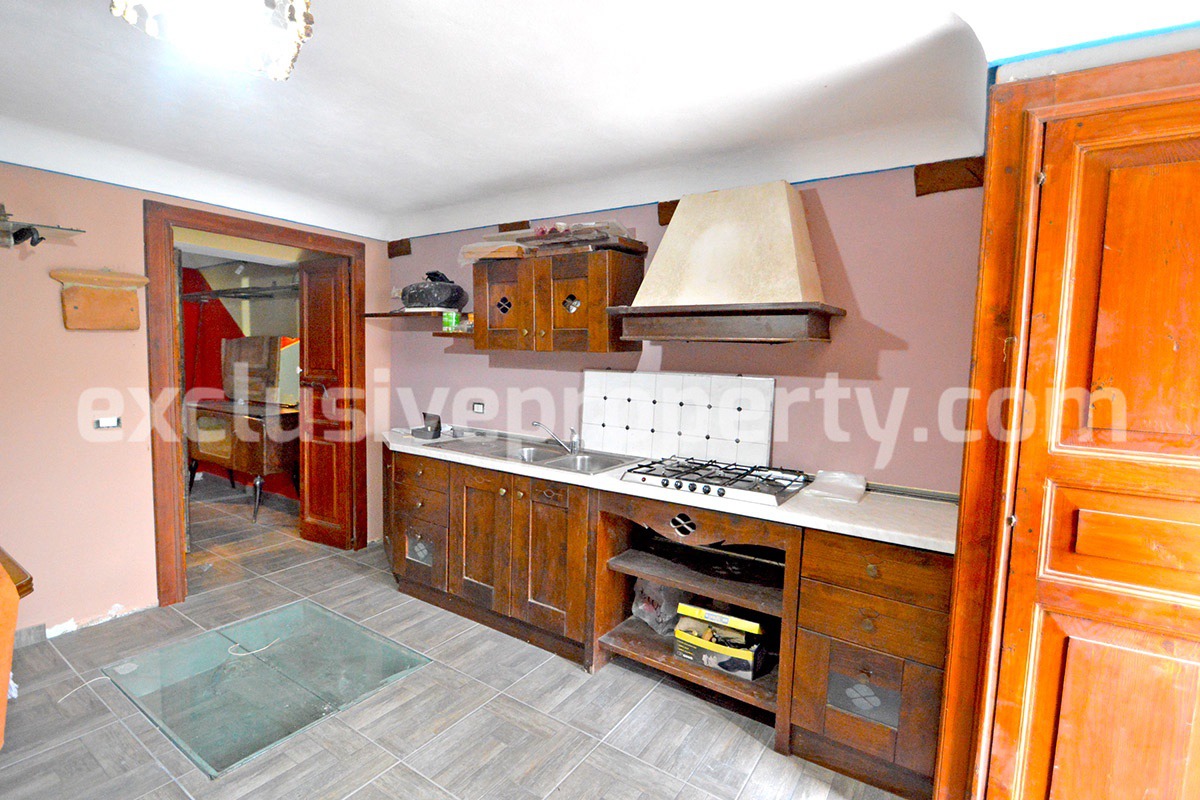 Renovated house with garden and two garages for sale in Italy 11