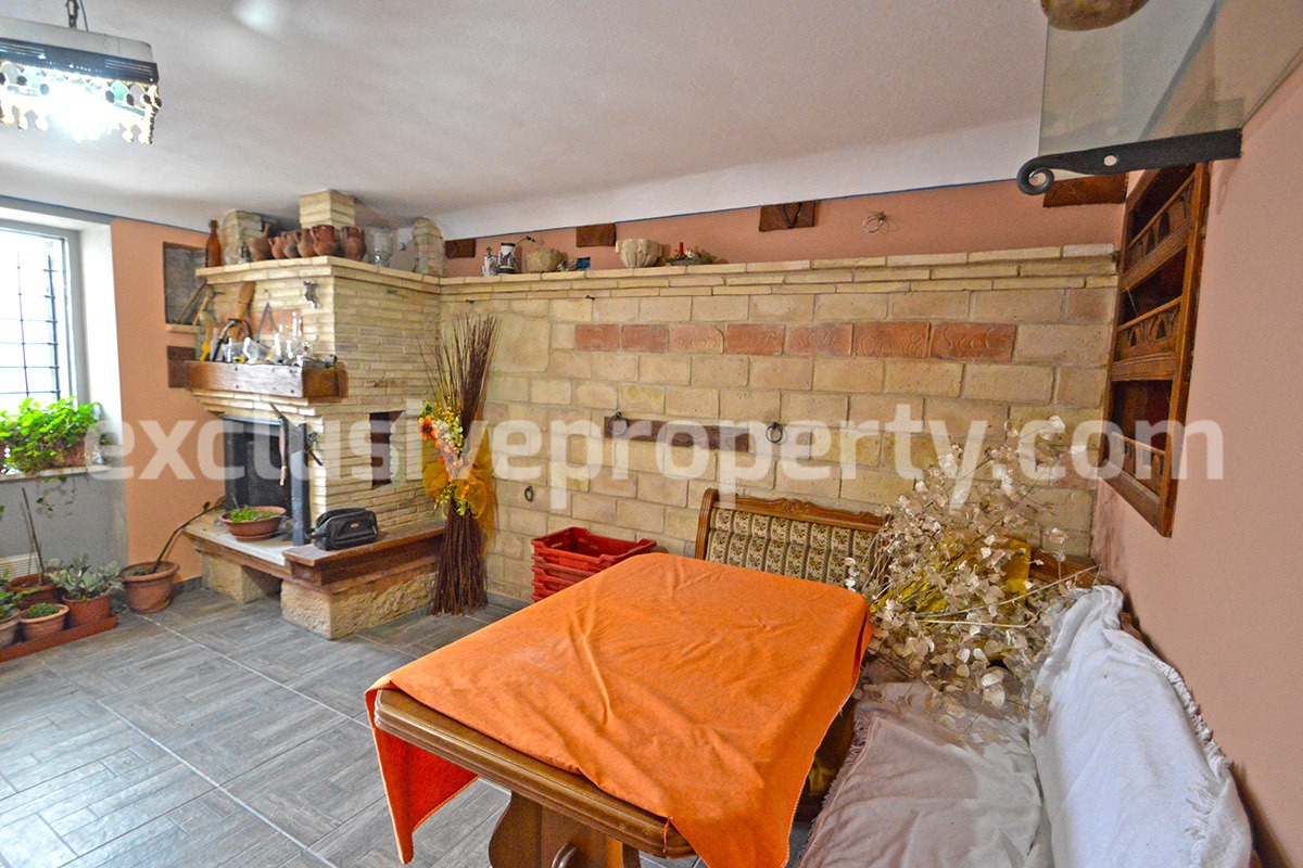 Renovated house with garden and two garages for sale in Italy 12