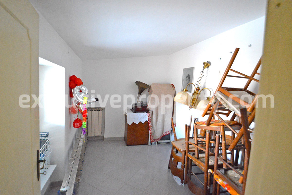 Renovated house with garden and two garages for sale in Italy 29