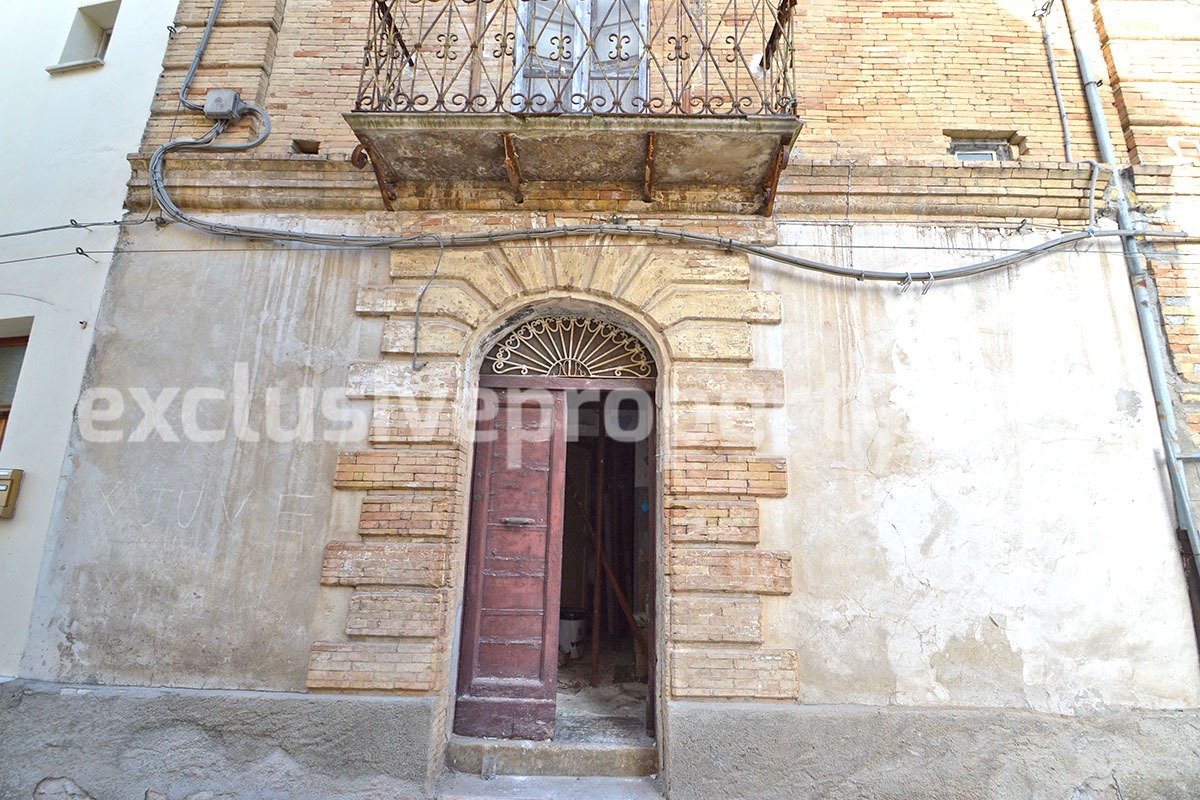 Stone and brick village house on three floors to be restored for sale in Furci Italy
