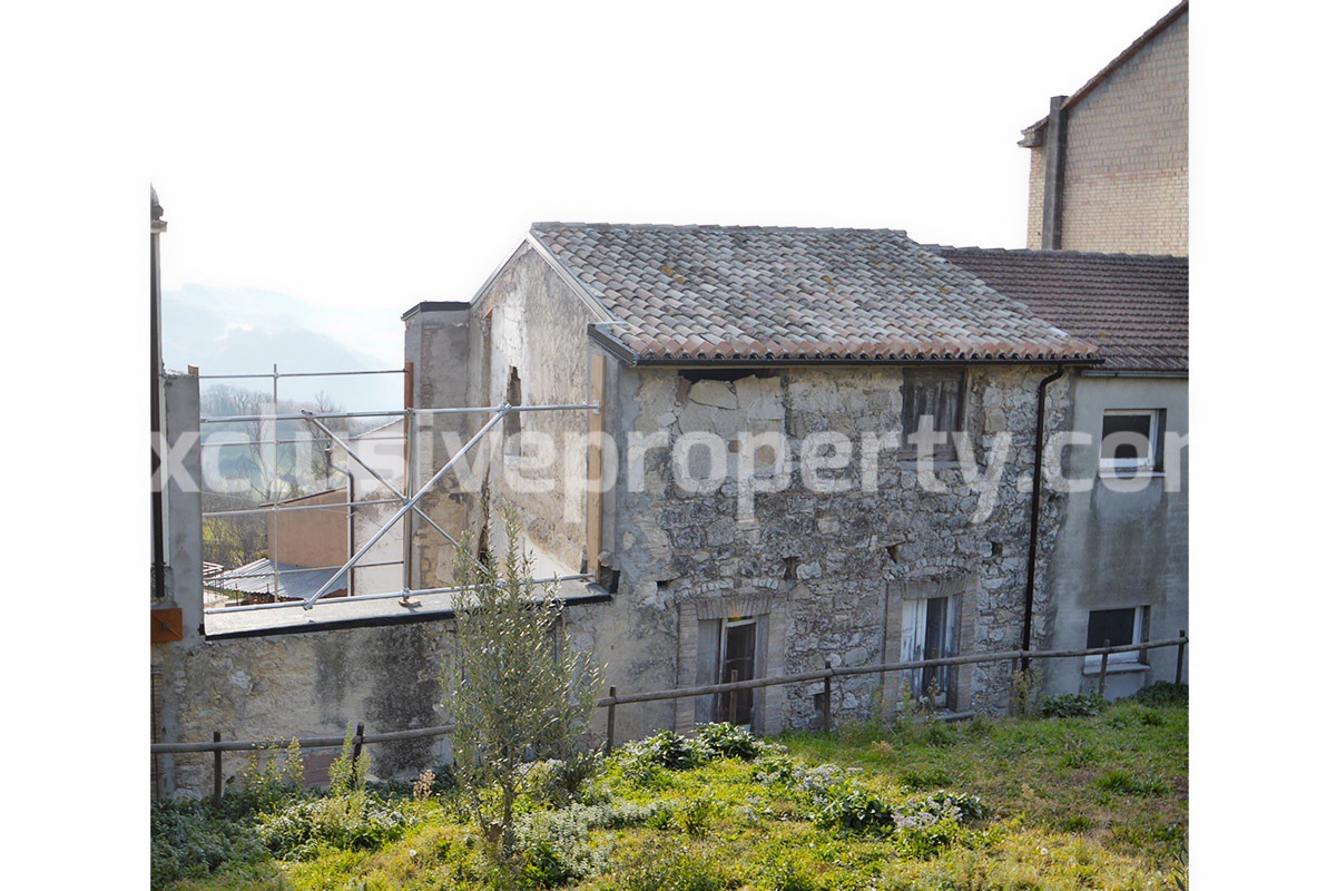 Stone and brick village house on three floors to be restored for sale in Furci Italy