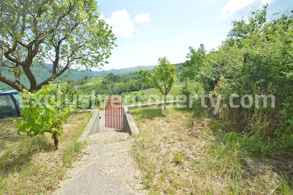 House with fenced flat garden with hillside view for sale in Abruzzo