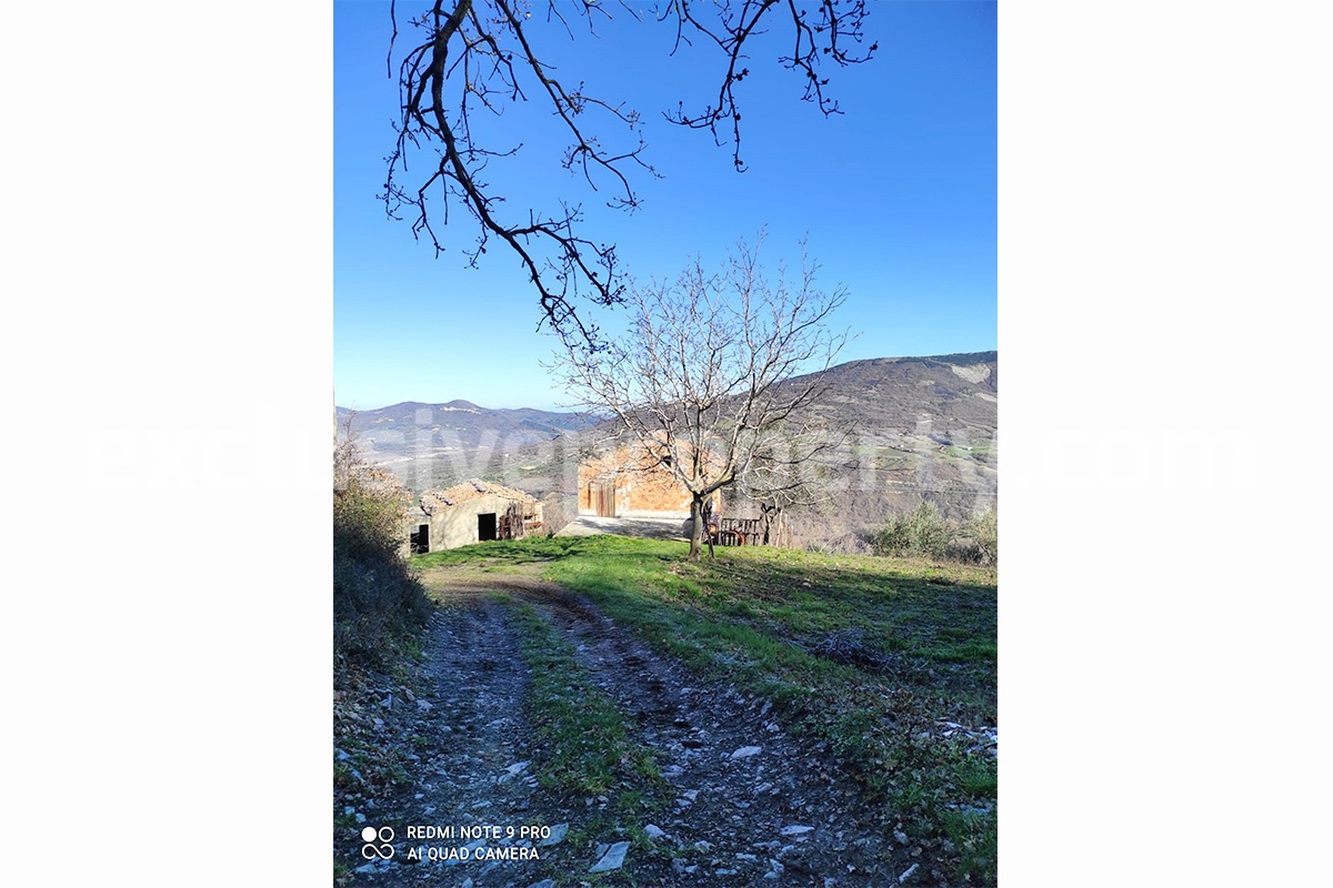 Brick farmhouse surrounded by nature with well for sale in Italy 5