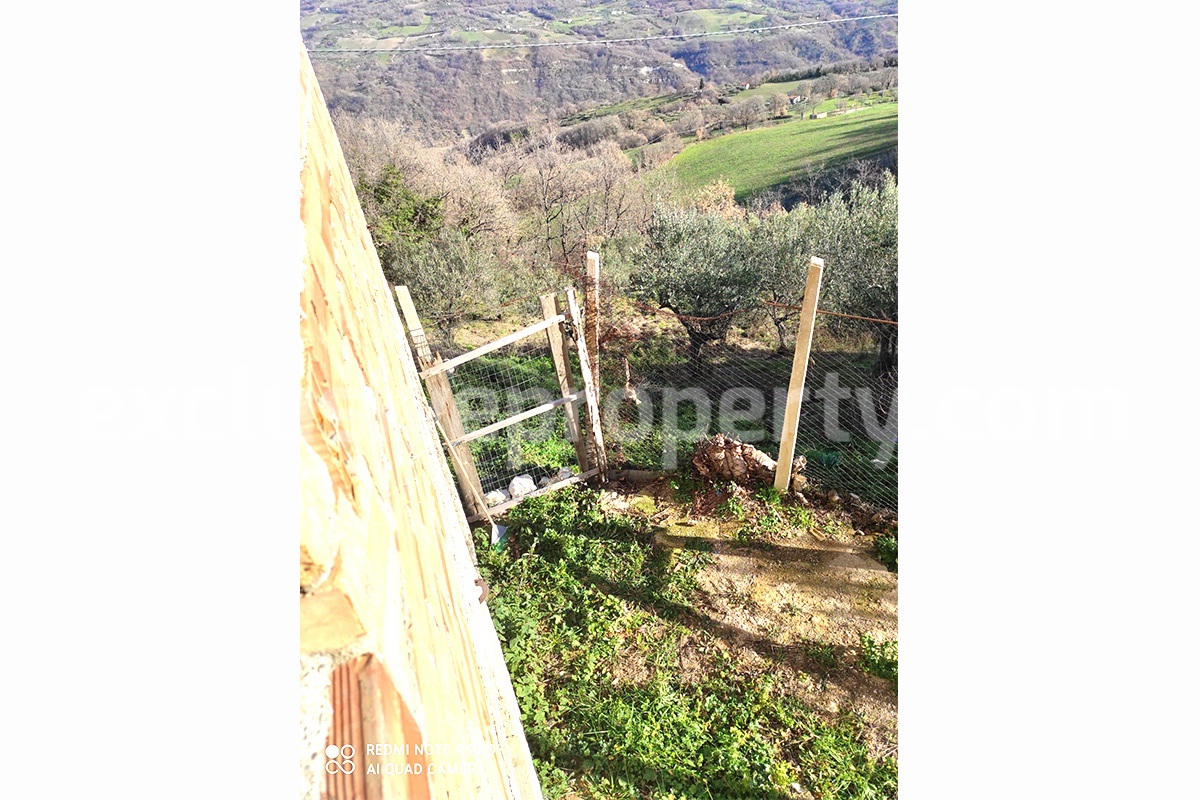 Brick farmhouse surrounded by nature with well for sale in Italy 19