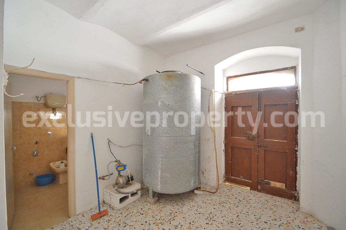 Traditional stone house with terrace and fenced garden for sale in Molise