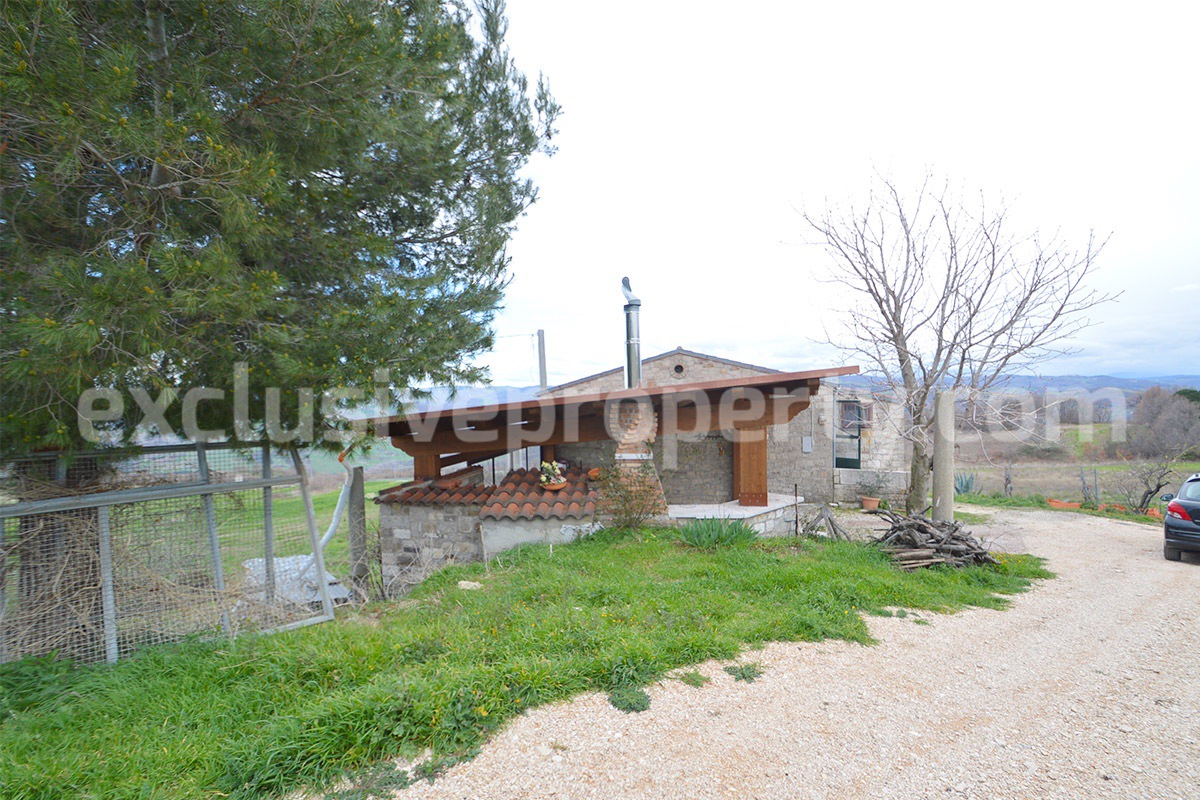 Nice stone country house with land and large wooden veranda for sale in Italy - Molise