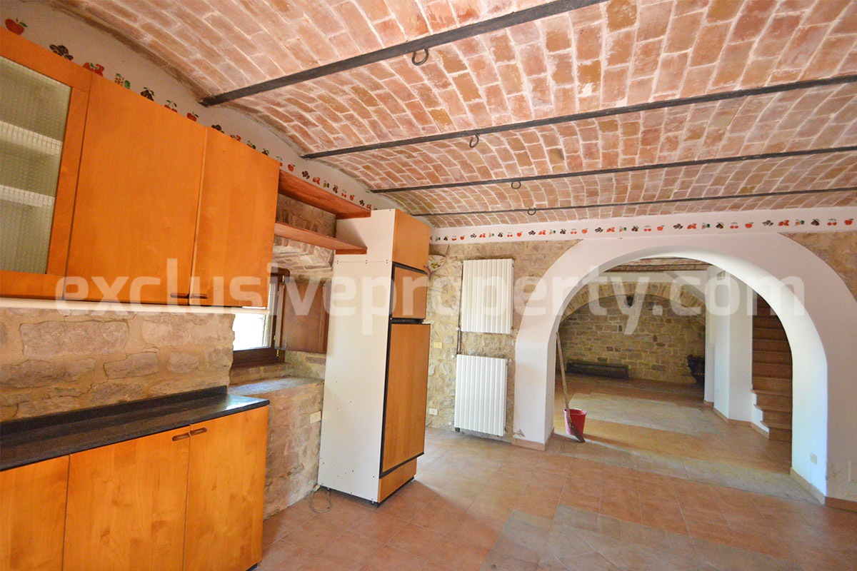 Ancient renovated country stone farmhouse move in ready in with fenced garden for sale in Italy