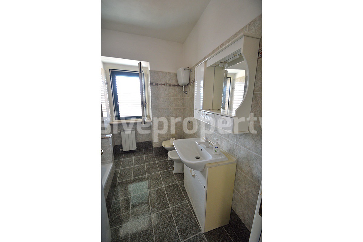 Stone Apartment for Sale in Abruzzo - Renovated Home with Balcony - Views and Historic Marble Portal