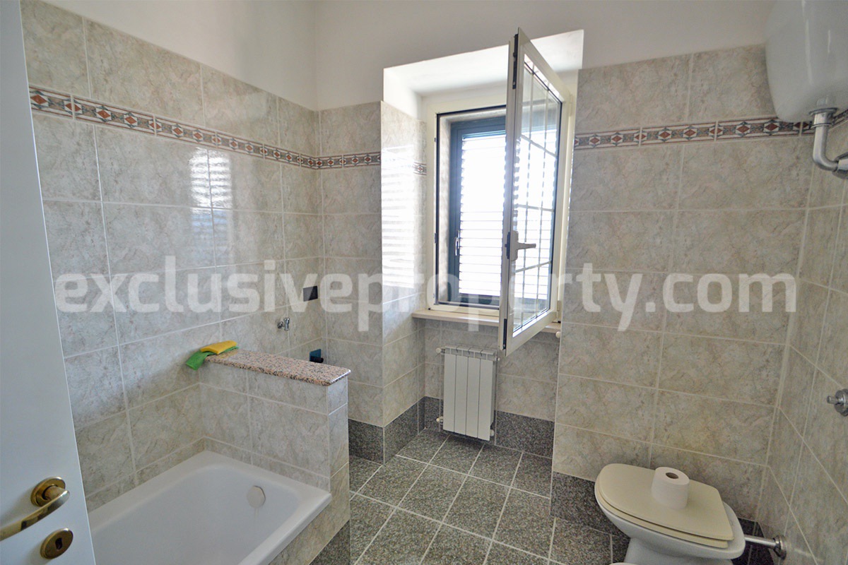 Stone Apartment for Sale in Abruzzo - Renovated Home with Balcony - Views and Historic Marble Portal