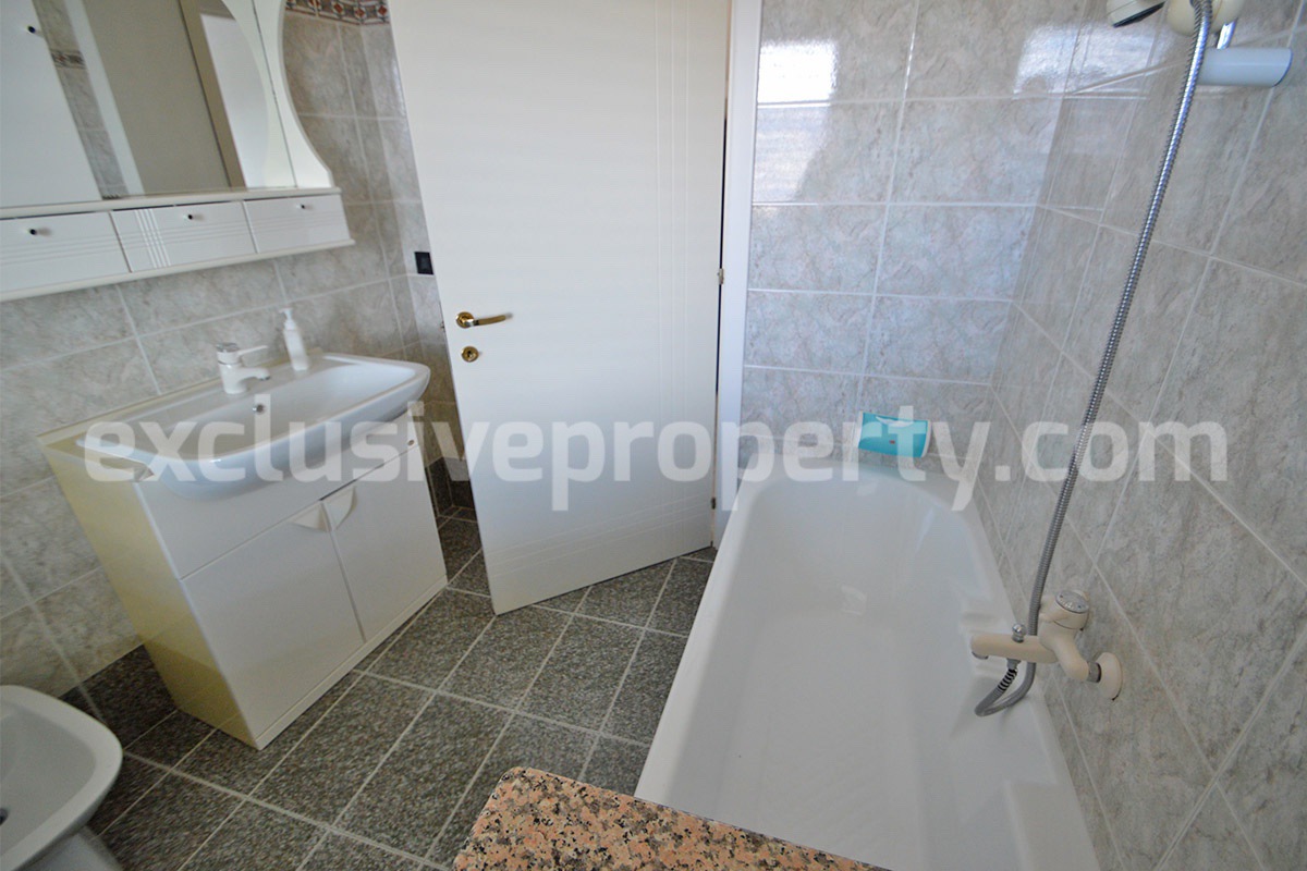 Stone Apartment for Sale in Abruzzo - Renovated Home with Balcony - Views and Historic Marble Portal