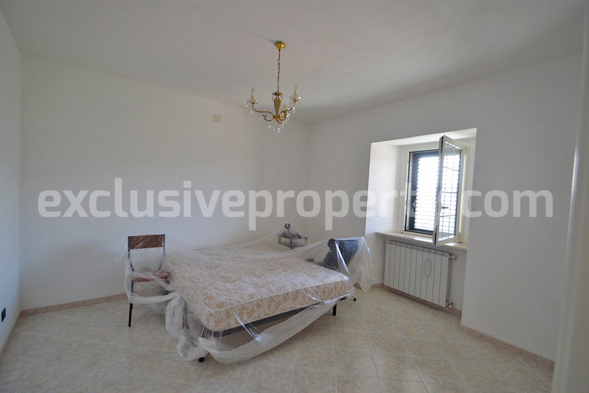 Stone Apartment for Sale in Abruzzo - Renovated Home with Balcony - Views and Historic Marble Portal
