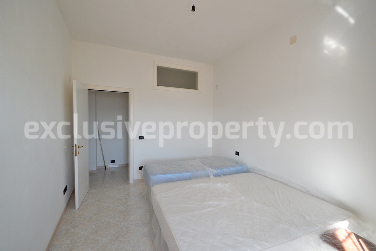 Stone Apartment for Sale in Abruzzo - Renovated Home with Balcony - Views and Historic Marble Portal